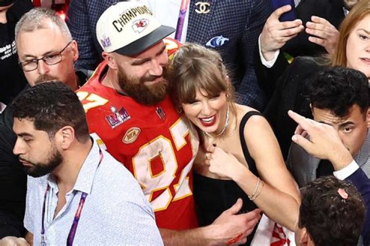Taylor Swift, Travis Kelce share a kiss while dancing to Swift's 'Love Story' at Super Bowl celebration